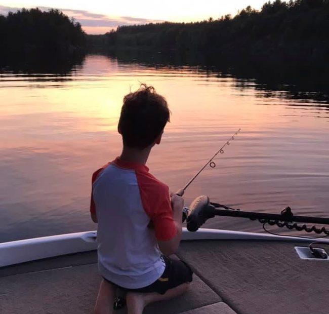 Kid Fishing at Sunset